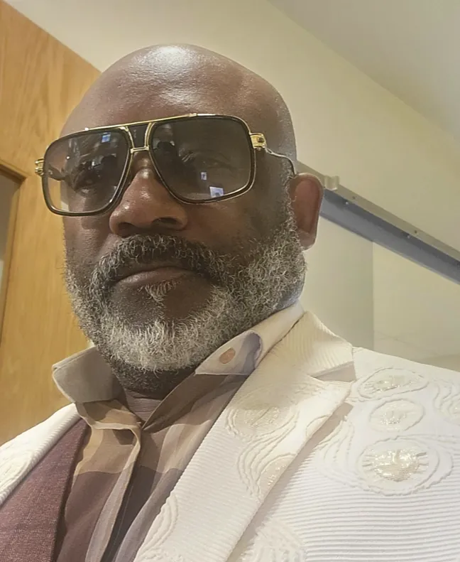Robert Johnson Jr. in a white jacket